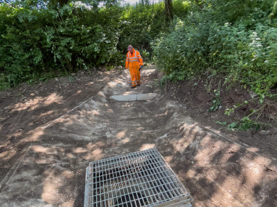 Highway drain gulley cleared of debris.