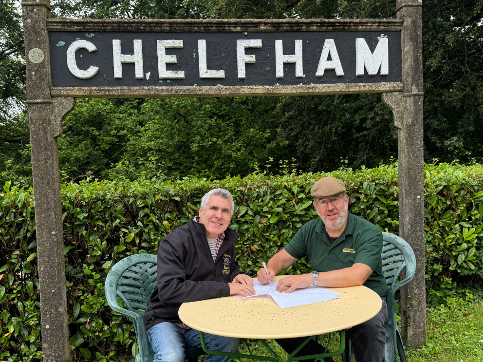 Chairs of the L&BRT and B&YVRT sign the MOU at Chelfham station