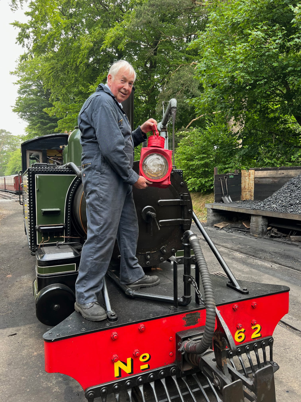 Chairman Peter Miles with Lyn and the original headlamp
